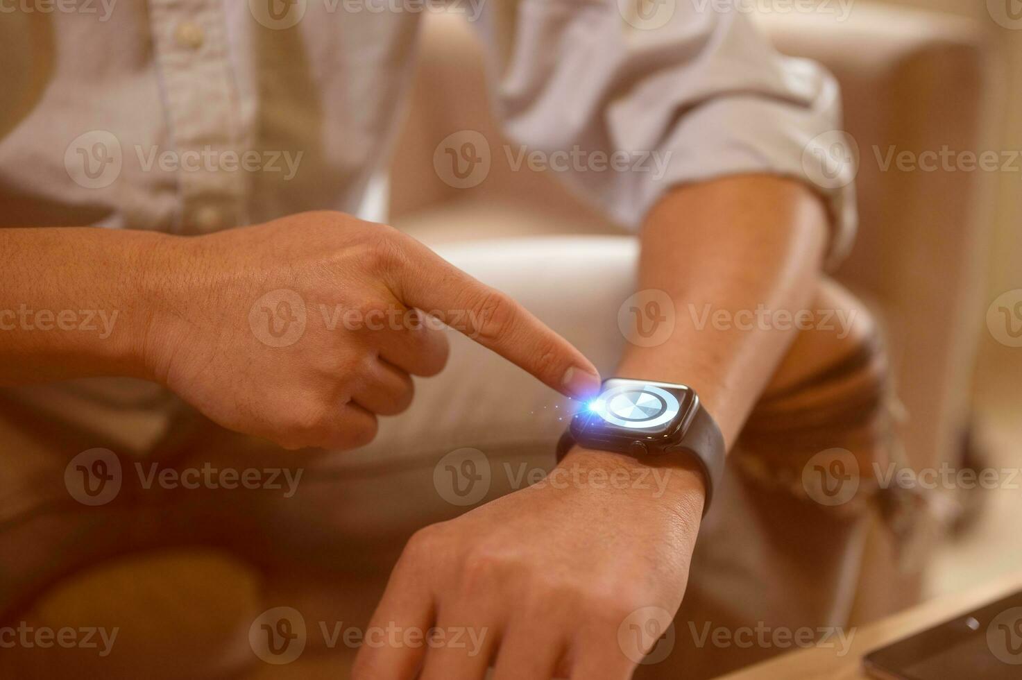 man pointing at wristwatch in a concept of time management schedule appointment meeting punctual photo