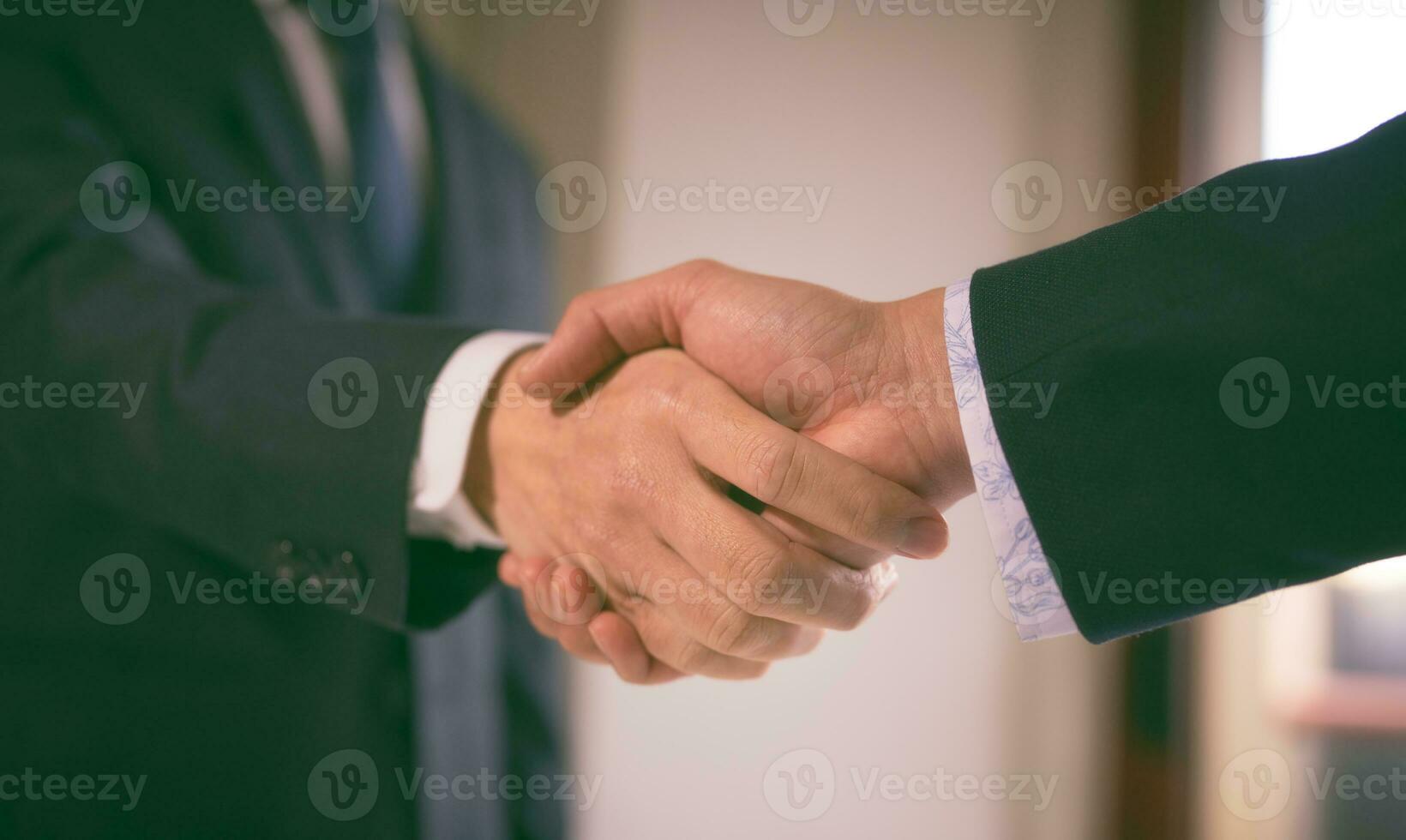 businessman shake hand with partner to celebration partnership and business deal concept, Businessman handshake for teamwork of business merger and acquisition, successful negotiate, hand shake photo