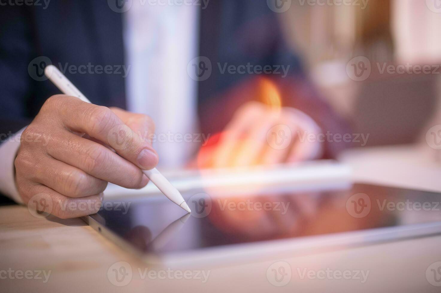 Businessman writing on tablet notebook in office on table. Concept of finance planing and analyzes business and growth. working from home concept. photo