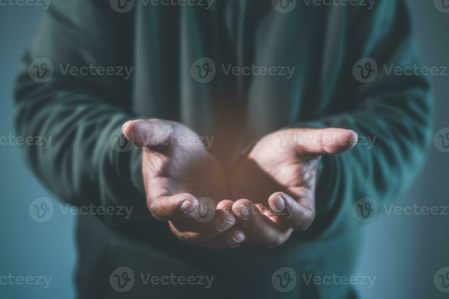 concept of hope helping hands, Praying hands with faith in religion and belief in God on blessing background. Power of hope or love and devotion. Magic powder floating on the magician hand photo