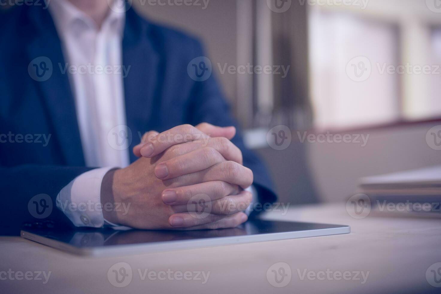 Hands of a thoughtful, hr recruiter making hiring decision at difficult job interview, opponents dialogue debate, business confrontation challenge concept, pray hope and negotiation business dealing photo