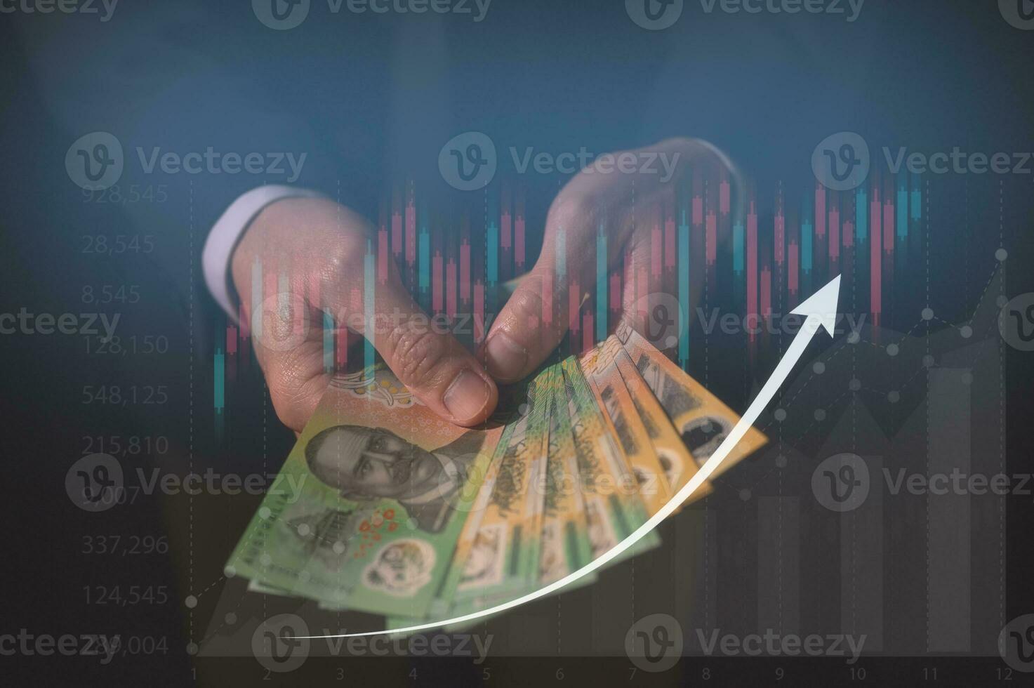 investment and financial saving concept, Money, Australian dollar AUD banknotes, in businessman hands, trading property invest stock market investors photo