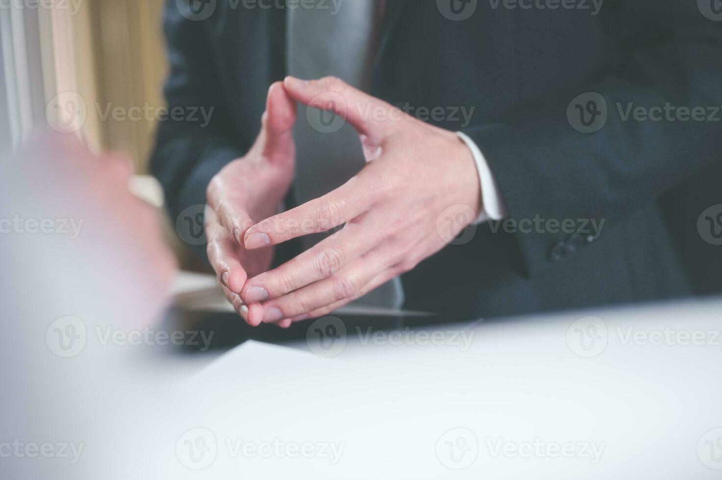 Body language concept, businessman standing with putting hands together showing positive thinking and calm photo