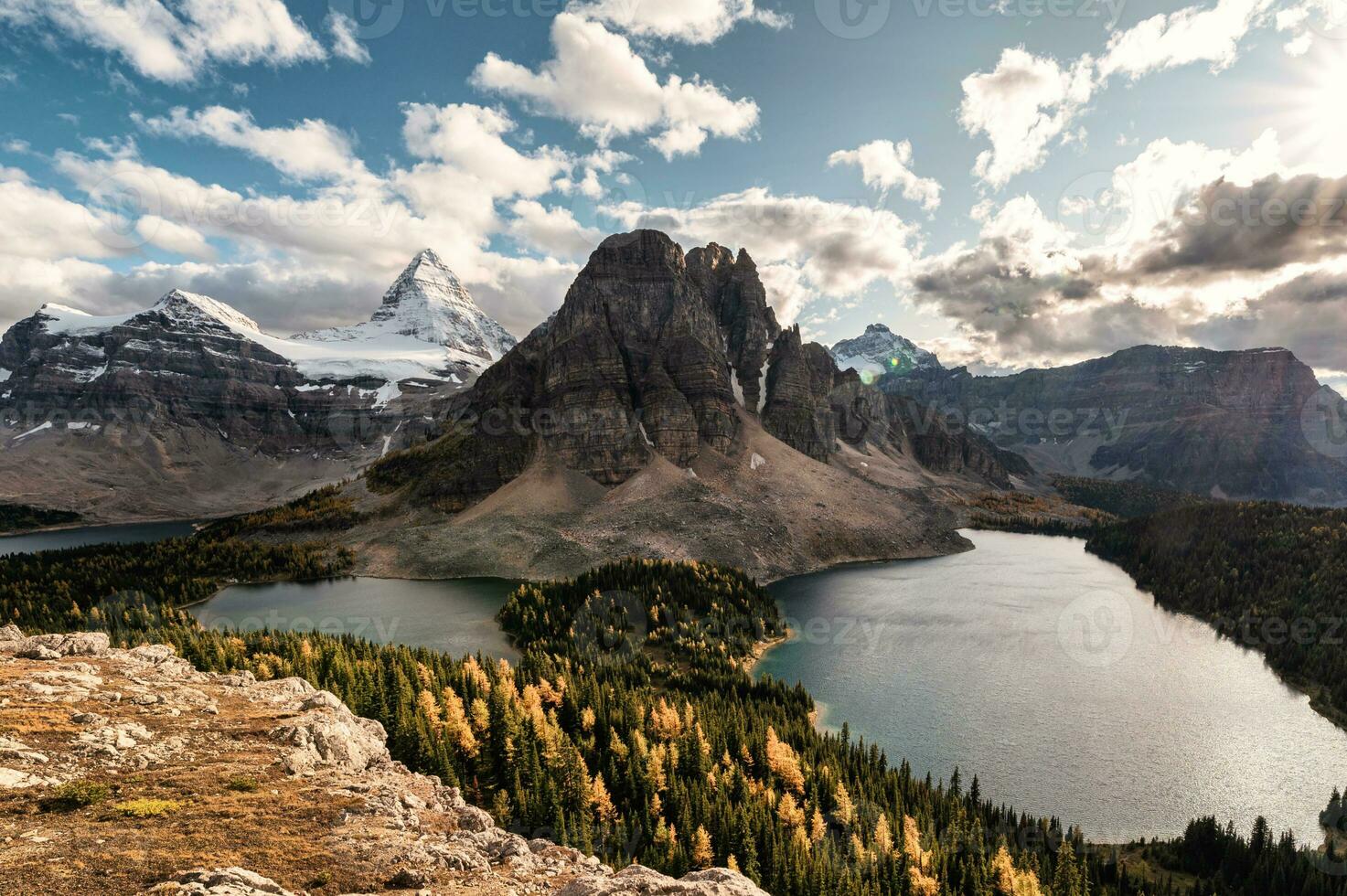 Mount Assiniboine with lake in autumn forest on Niblet peak at provincial park photo