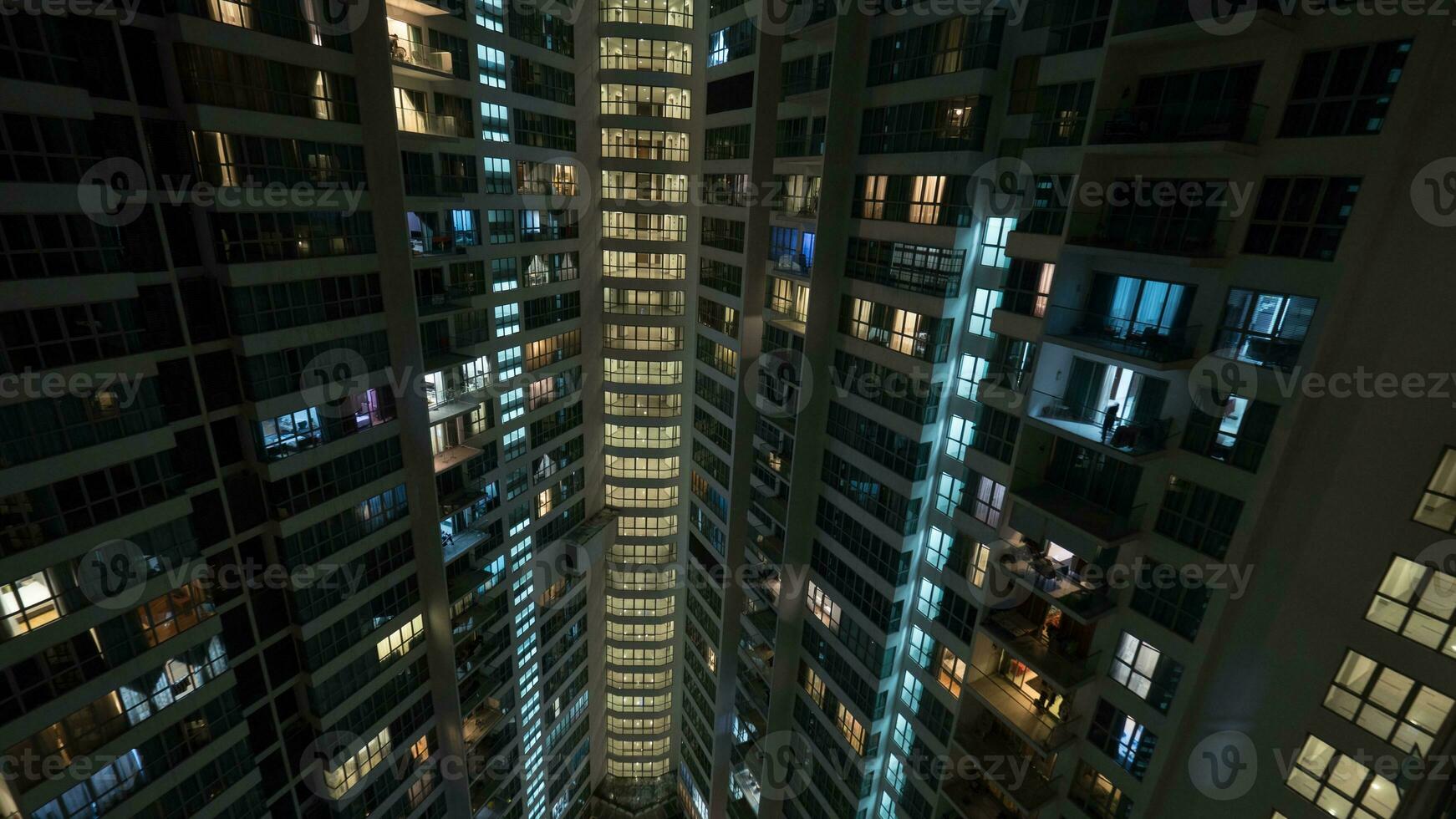 Window lights in multistorey house at night, Kuala Lumpur photo