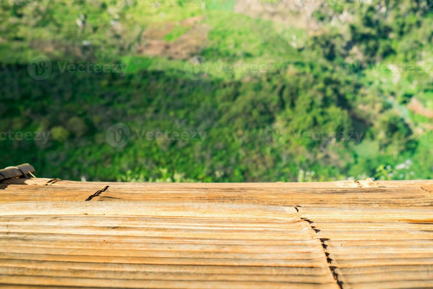 Wood table top on tea plantation photo