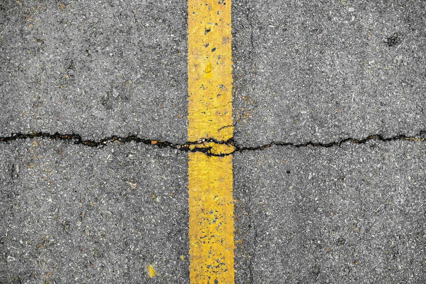 Crack on line yellow on road texture photo