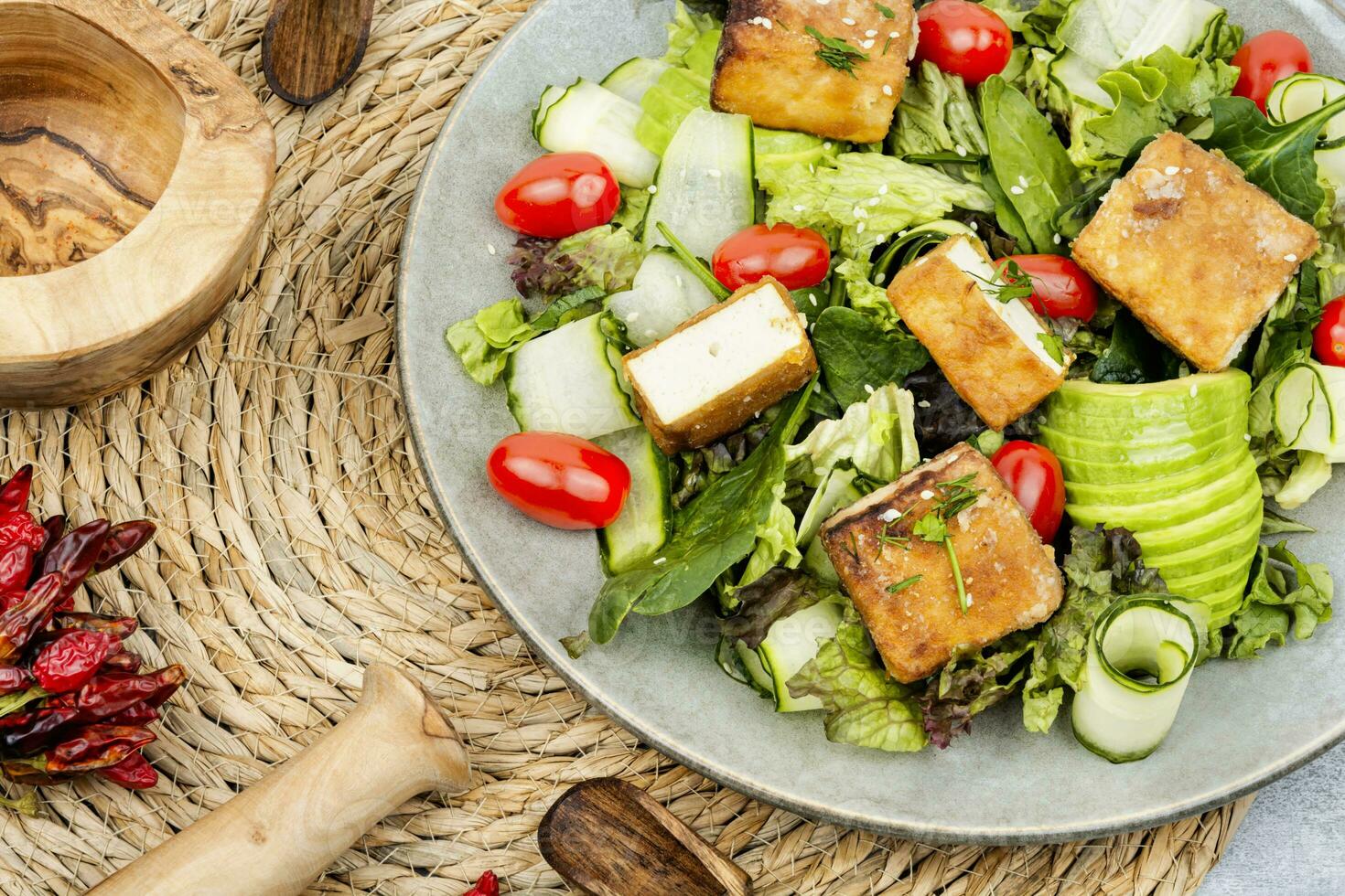 Salad with fresh vegetables and tofu. photo