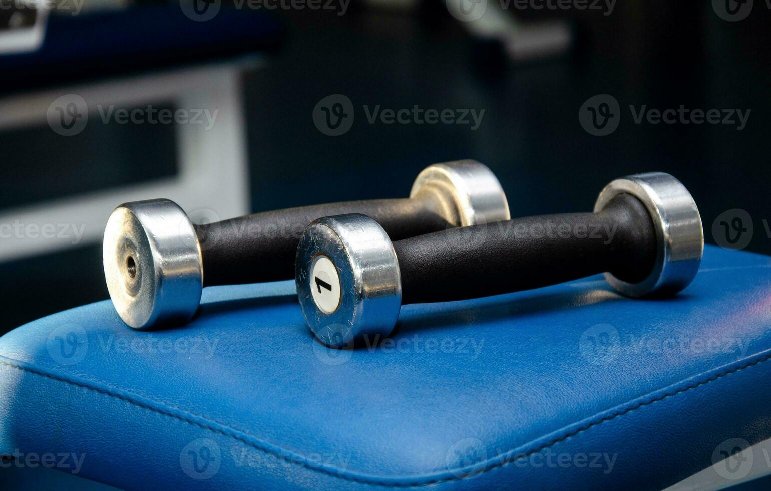 dumbbell, dumbbell in the gym on a blue background. gym for fitness. exercise equipment in the gym. photo