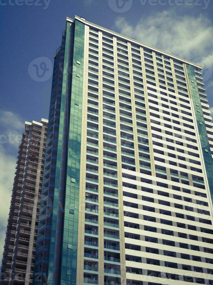 Modern multistory buildings under construction. Unfinished skyscrapers. photo