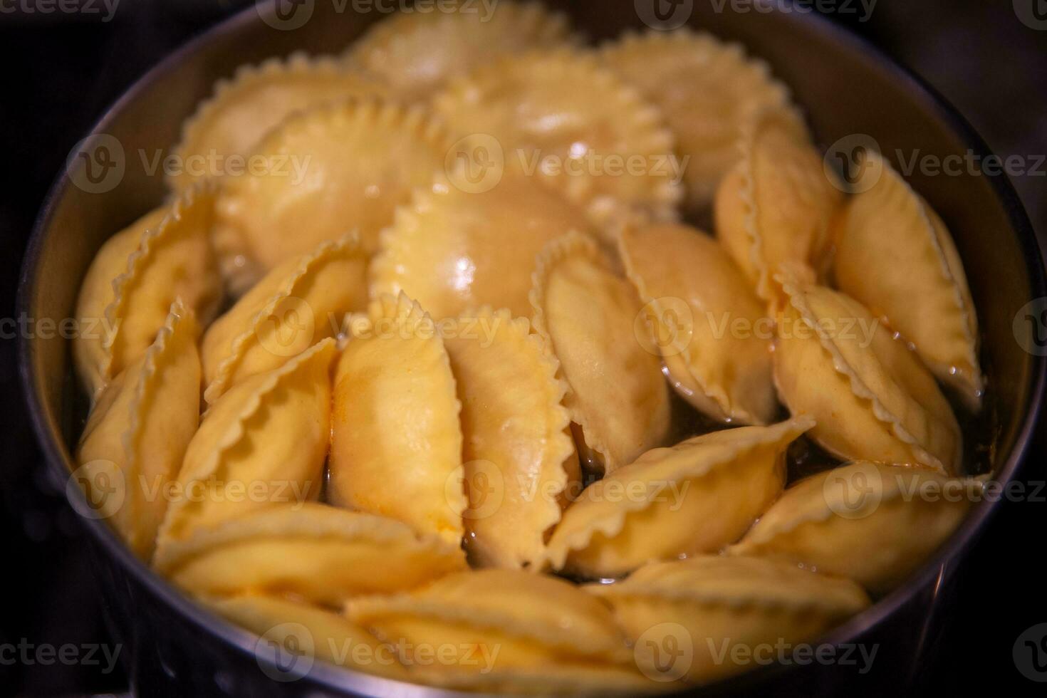 Boiling pot of ravioli photo