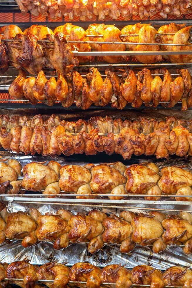 Rotisserie chicken on a rack photo