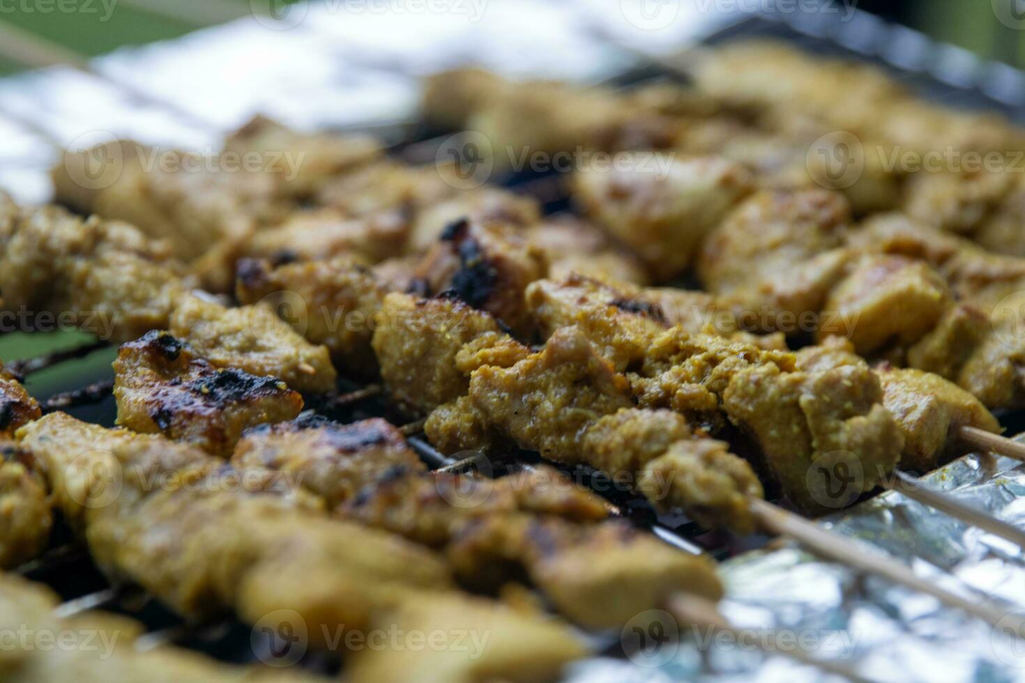 Grilling Chicken Satay photo