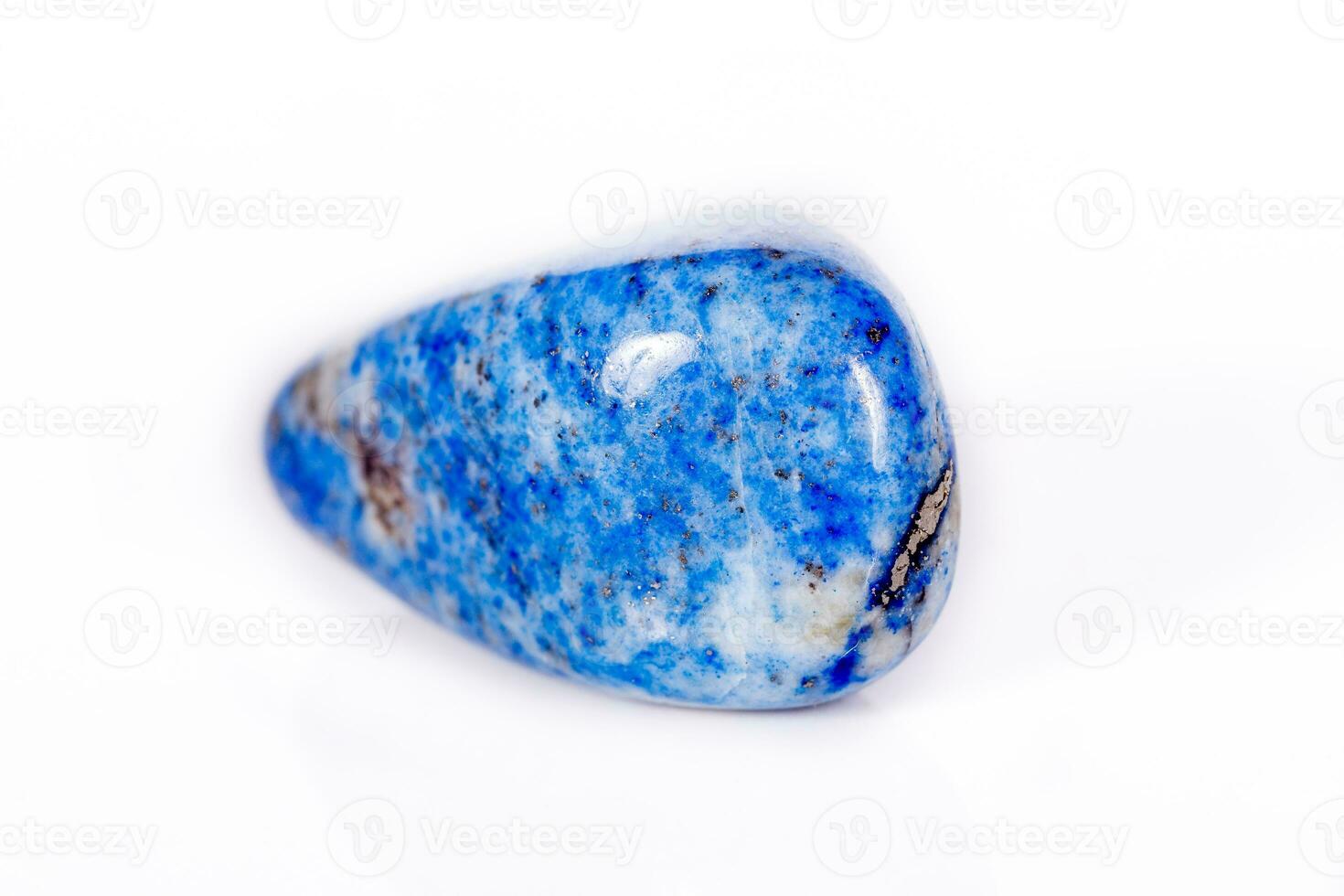 Macro mineral stone blue lapis lazuli afghanistan on white background photo