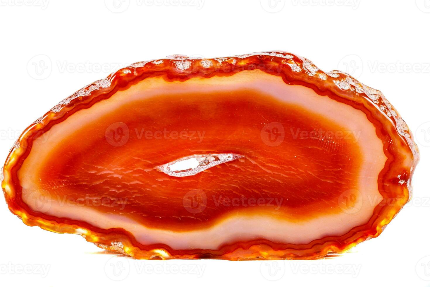 Macro mineral orange agate in crystals on white background photo