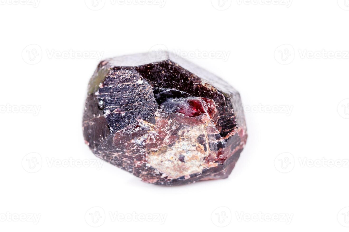 Macro of a mineral garnet stone on a white background photo