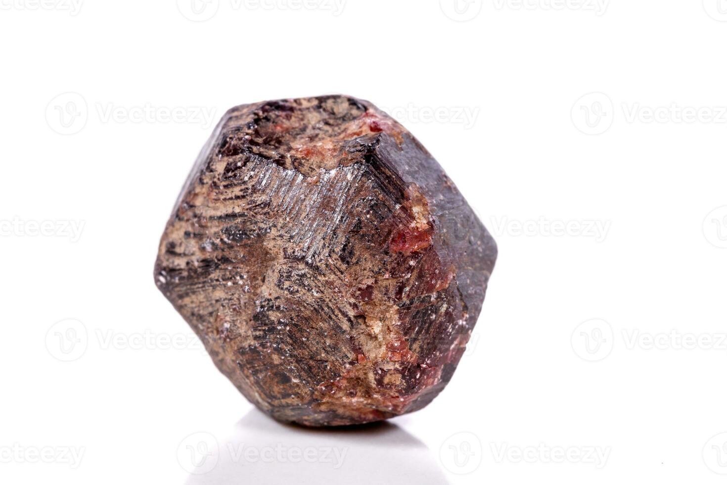 Macro of a mineral garnet stone on a white background photo