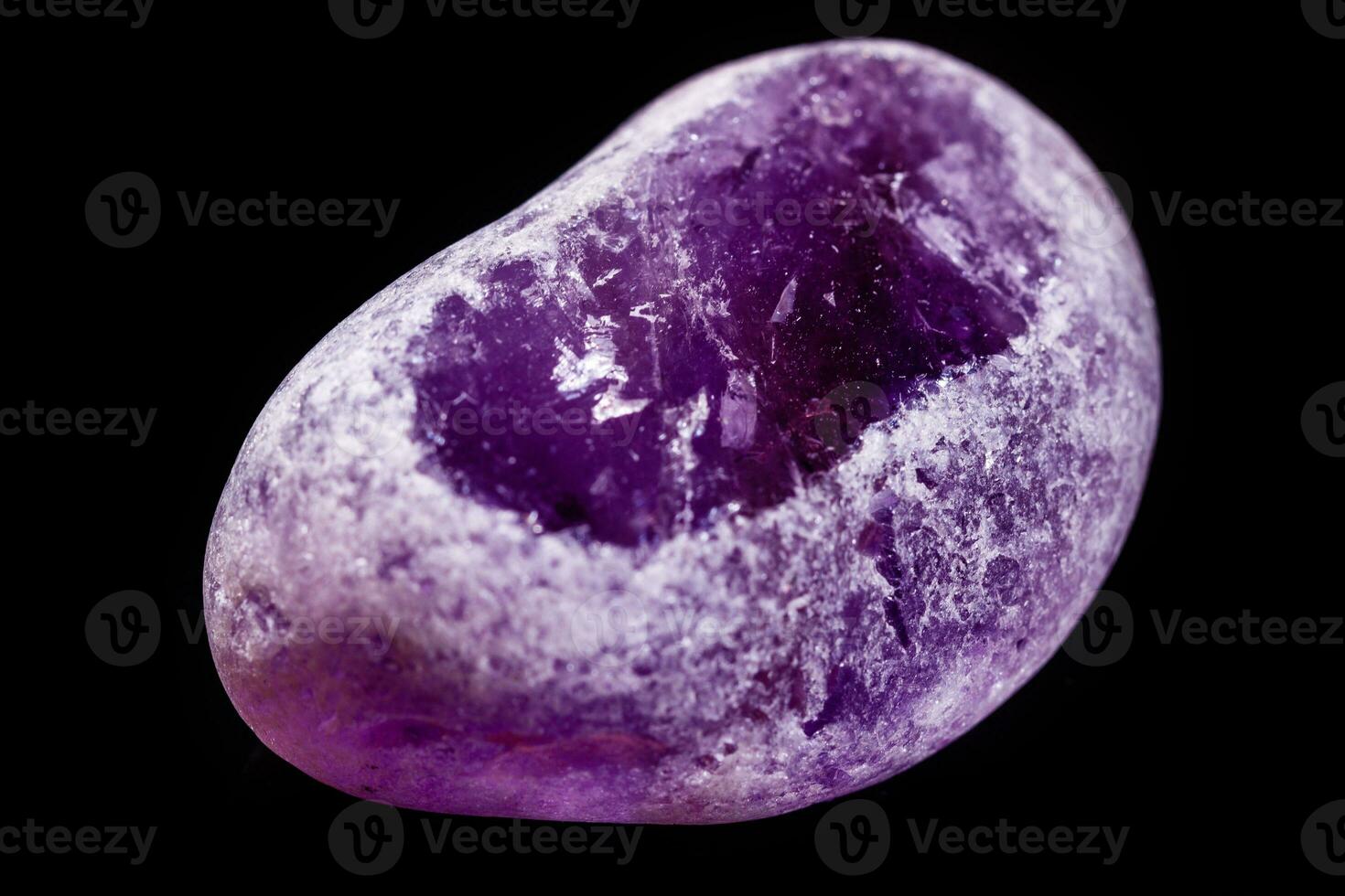 Macro mineral amethyst on a black background photo