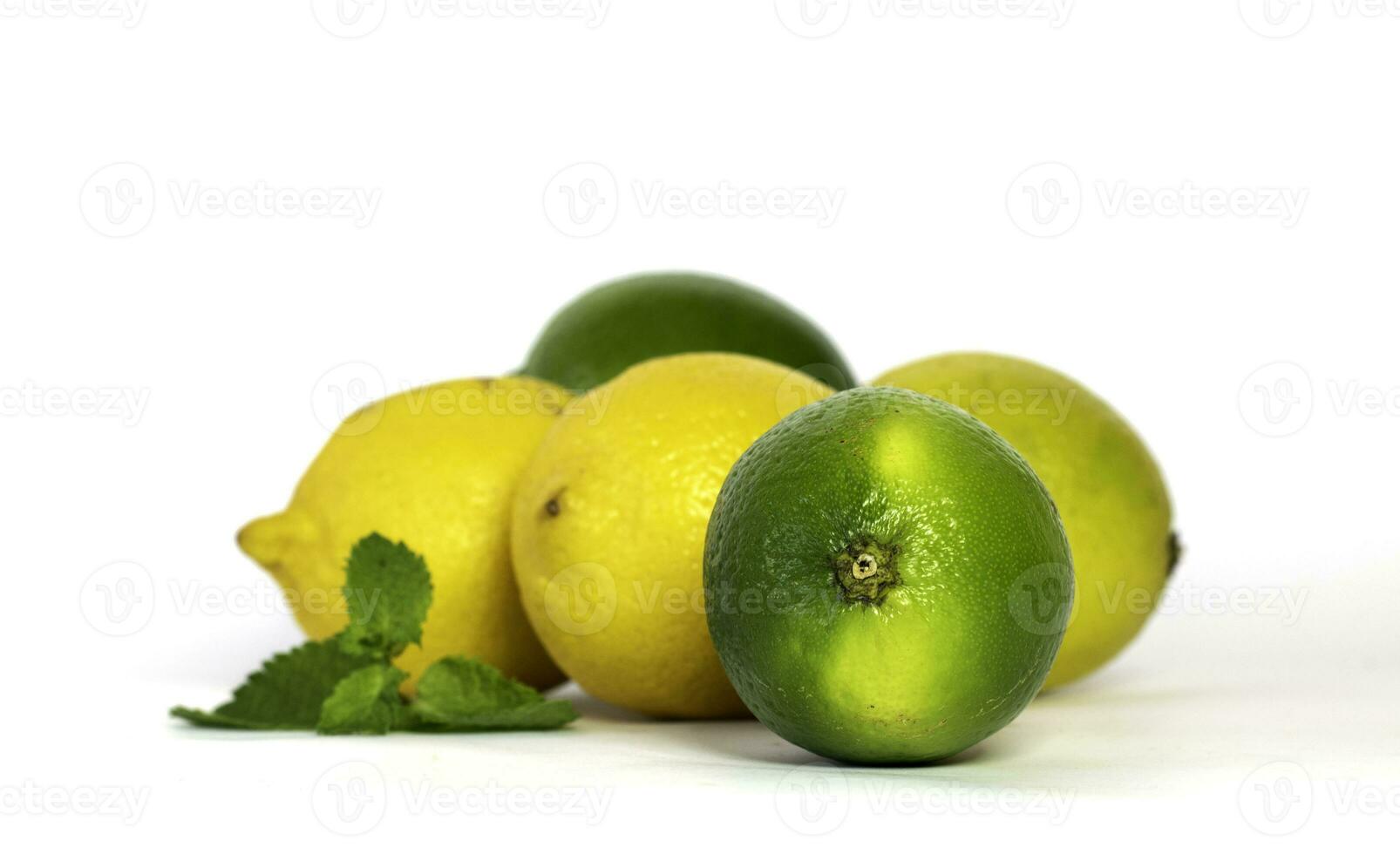 Group of lemons and limes on white background photo