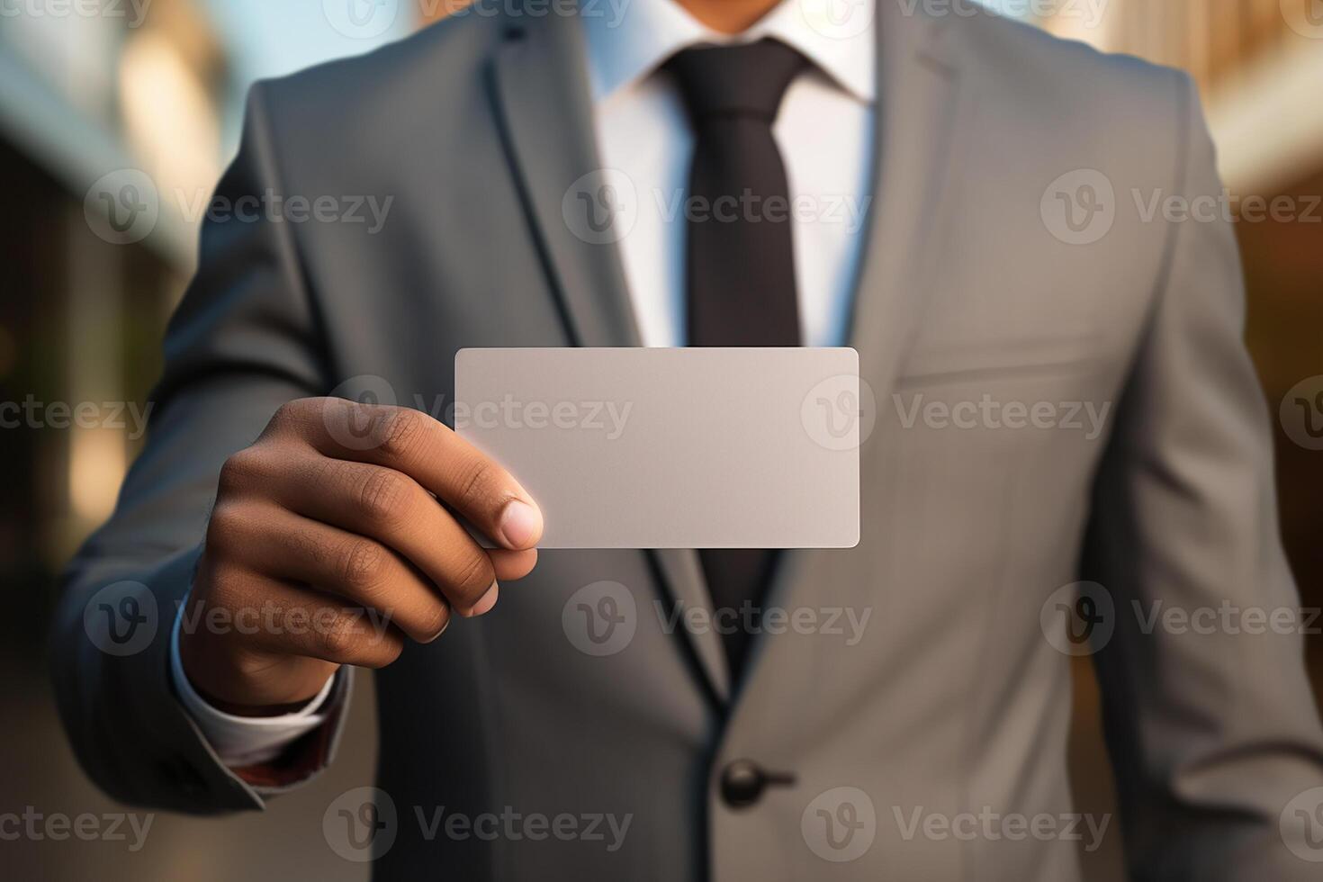 Businessman Wearing Formal Suit Showing Name Card to Show his Personal and Company Identity photo