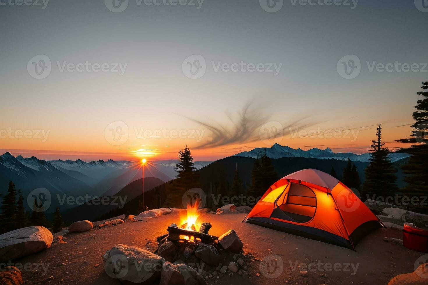 Camping tent high in the mountains at sunset photo