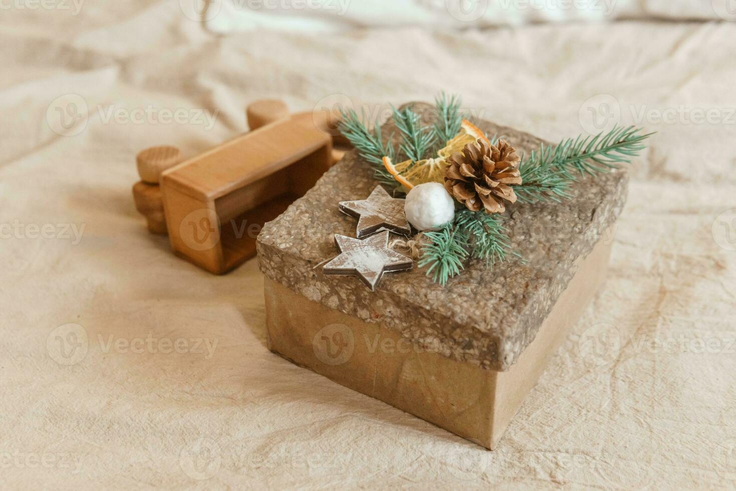 Brown craft box with a Christmas gift. Handmade gift. The concept of New Year and Christmas. photo