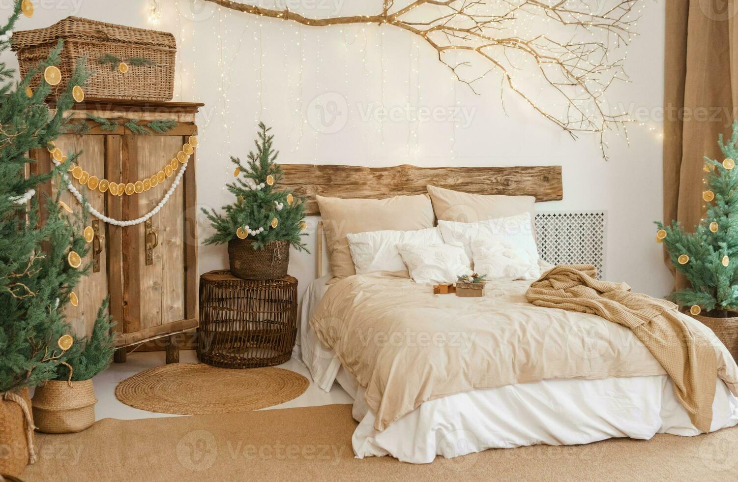 Cozy interior decorated for Christmas in Scandinavian style. Live fir trees decorated with natural ornaments made of dried oranges photo