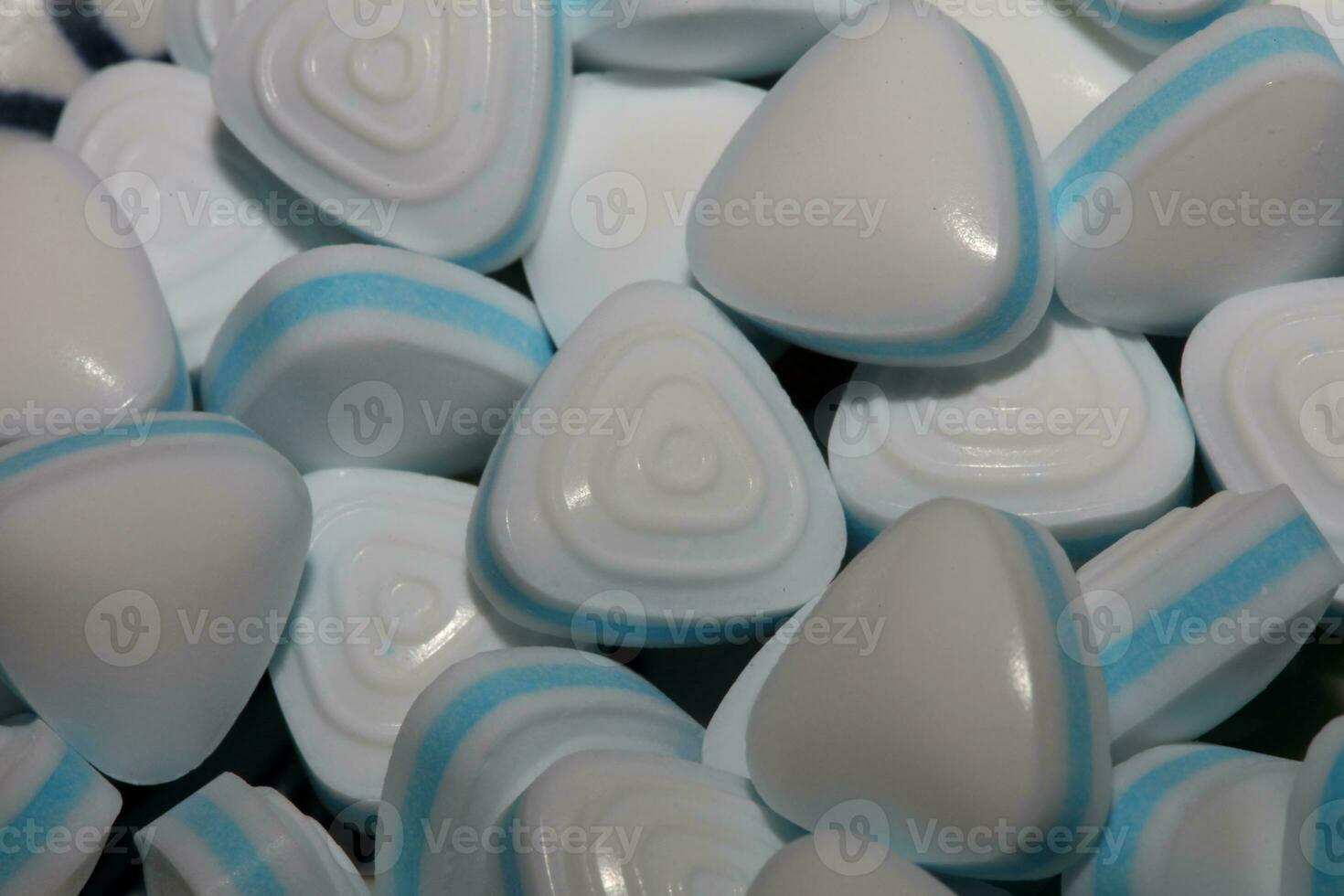 Group of sweet colorful candy light blue triangle refreshment caramel bubble gum macro view background modern high quality big size instant stock photography prints photo