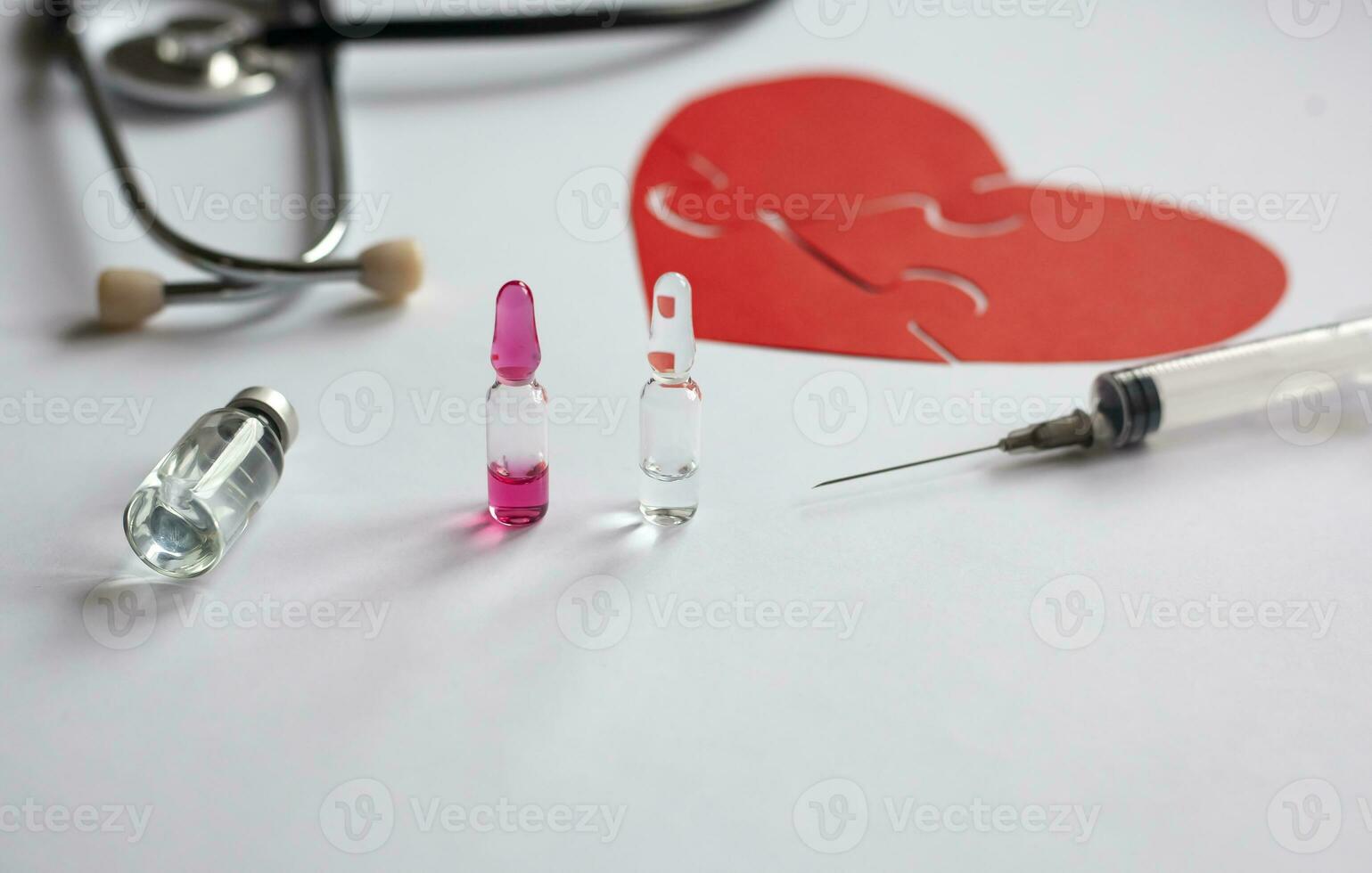 close up medicine, red heart, stathoscope and medical tablet on table, world health day, medicine and healthcare, life insurance business technology concept. photo