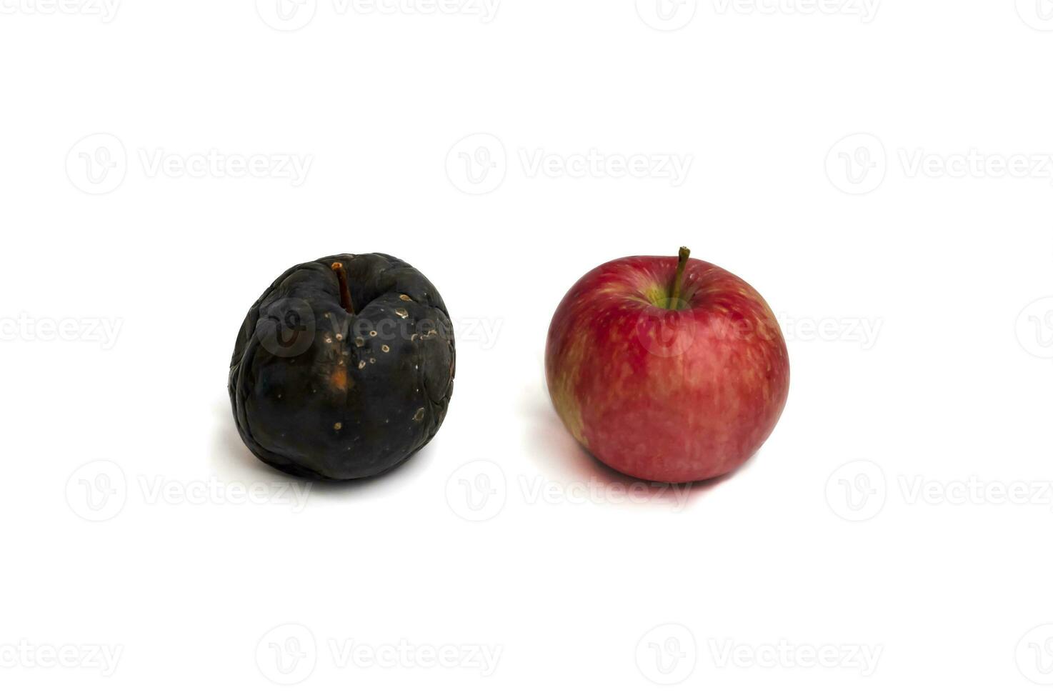 Wrinkled and fresh apple isolated on white background. Aging concept. photo