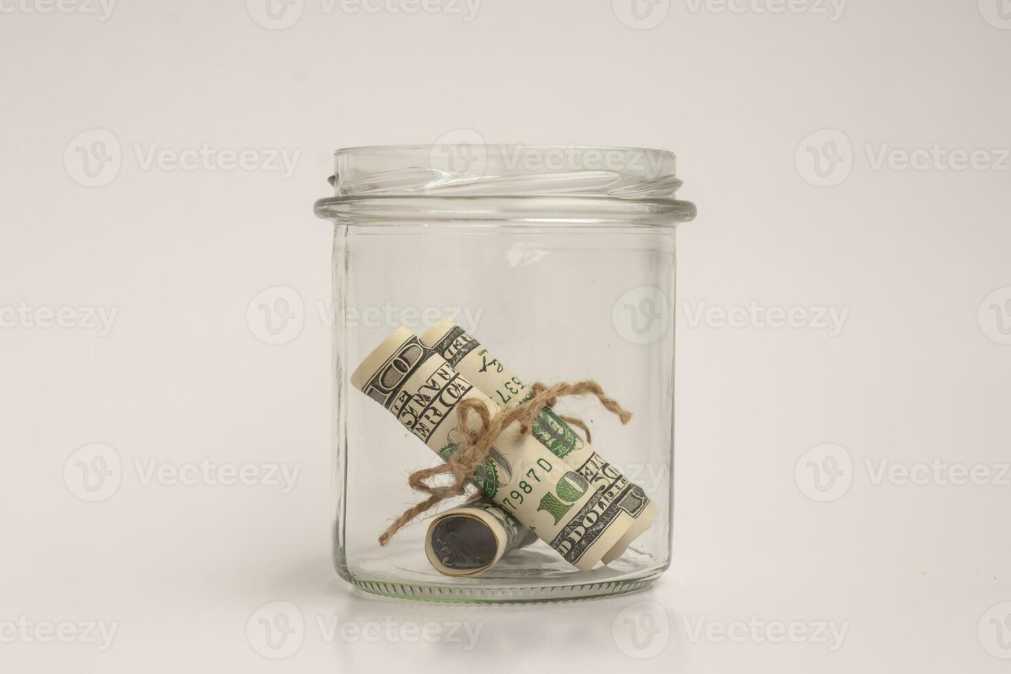 glass jar with dollars photo