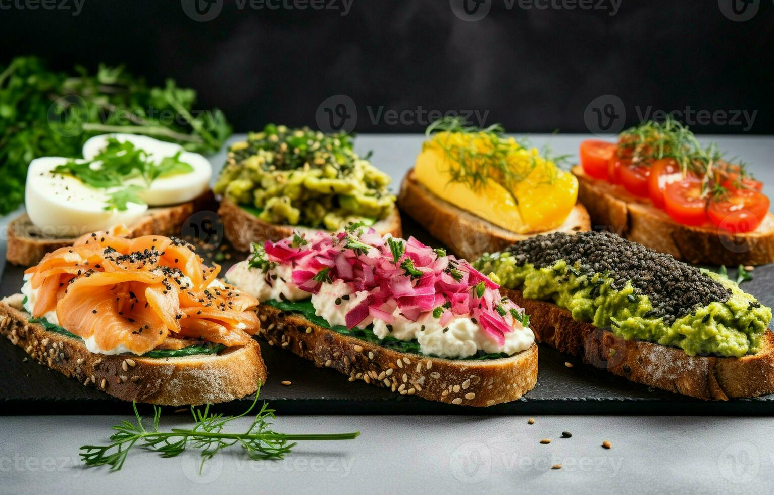 Enjoy a healthy protein toast topped with avocado, salmon, eggs, vegetables, tomatoes, herbs, pine nuts, sunflower seeds, and cream cheese, all on a bed of marble. photo