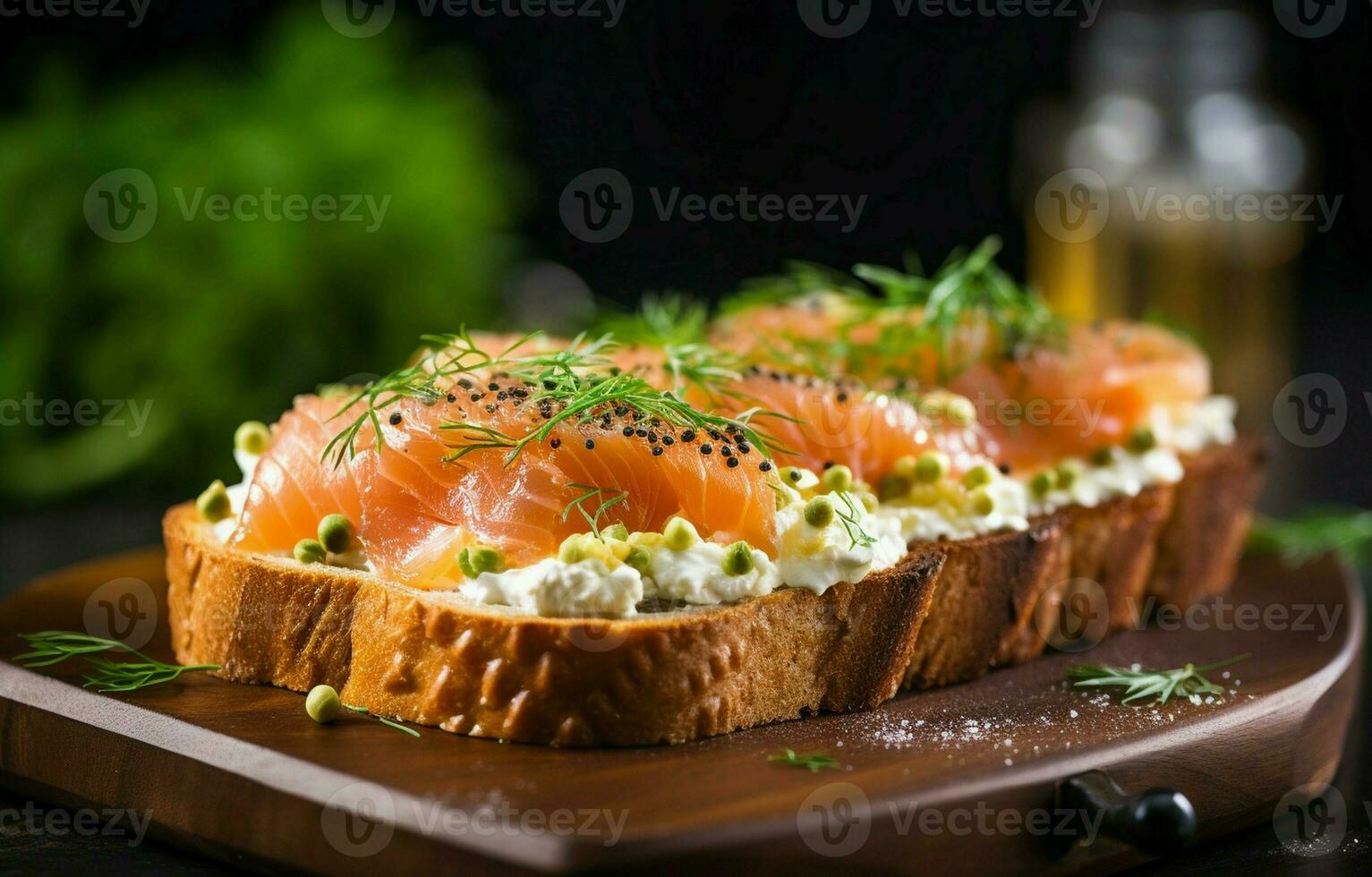 Rye bread toast topped with cream cheese, avocado, and smoked salmon. Perfect for breakfast, lunch, appetizer or snack. photo