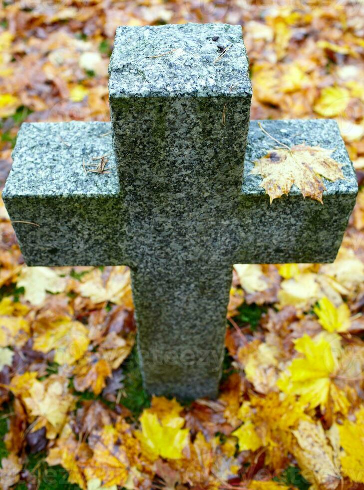 A granite tombstone cross photo