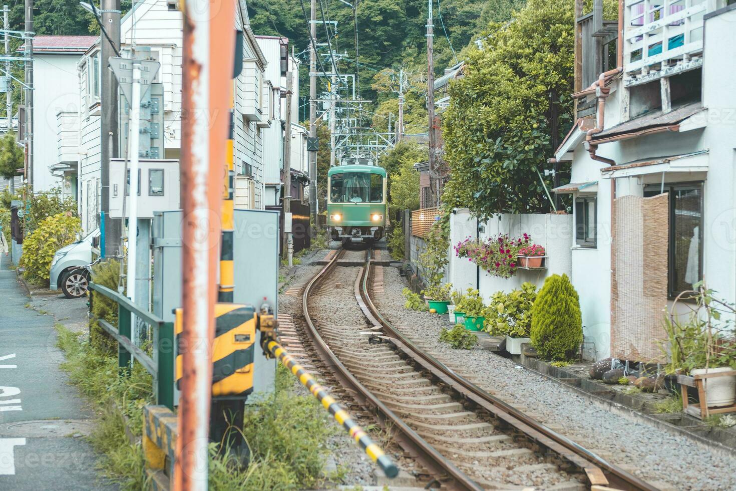 Enoshima tram or electric railway train at Fujisawa and Kamakura, Kanagawa, Japan photo