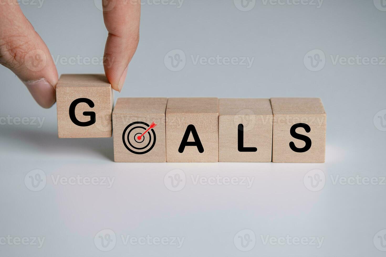 Wooden block with business goals. key performance indicator and business achievement goal concept. photo
