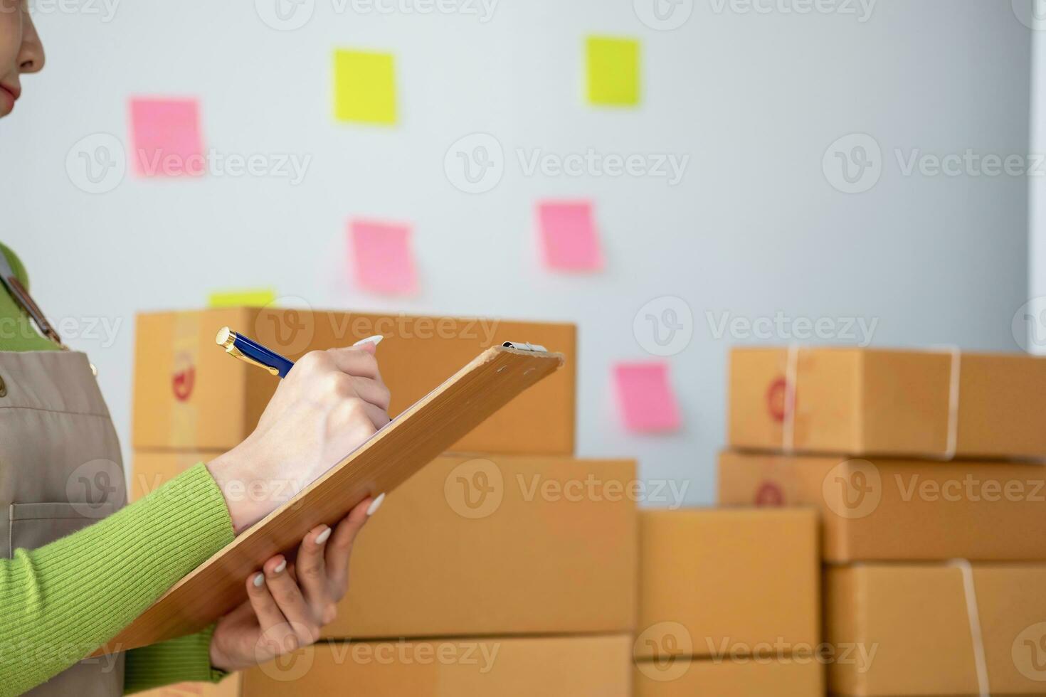 Starting a small business SME business owners, entrepreneurs, unboxing work check order online To prepare to pack into boxes for sale to customers, SME business ideas online. photo