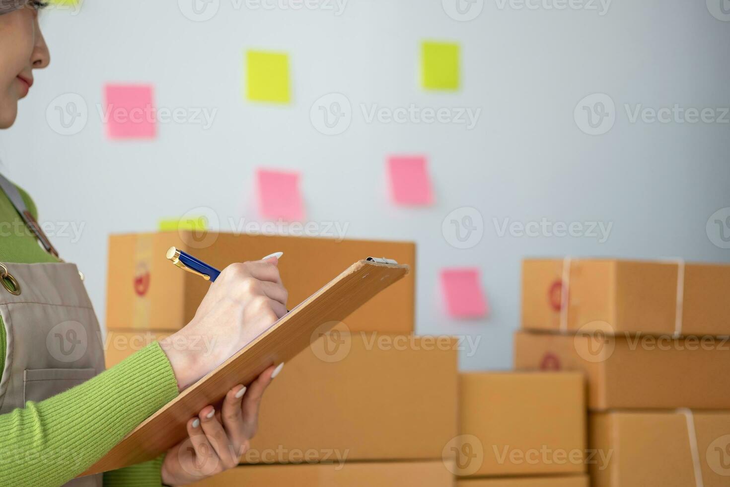 Starting a small business SME business owners, entrepreneurs, unboxing work check order online To prepare to pack into boxes for sale to customers, SME business ideas online. photo