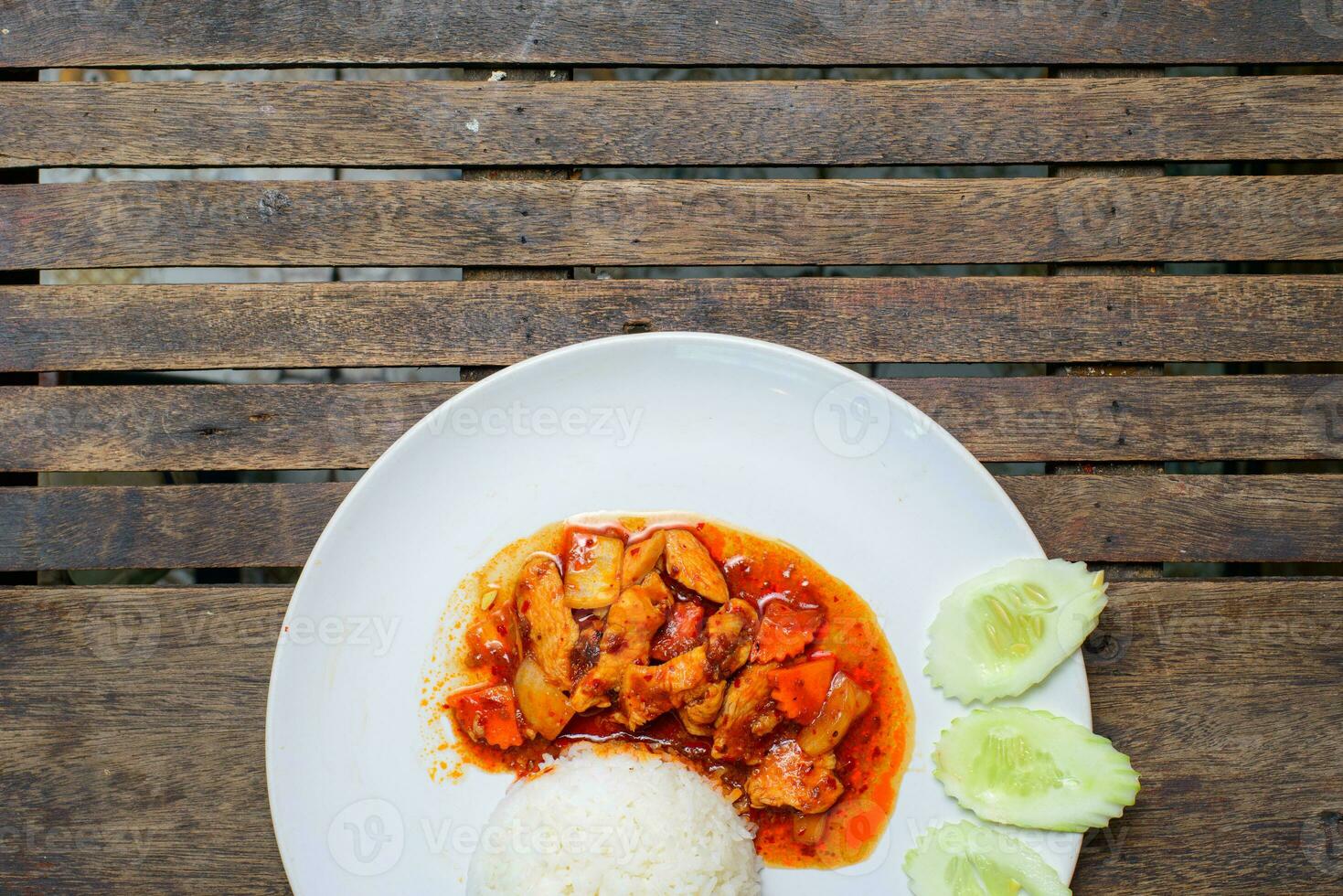 Sweet and Sour Chicken on the wooden background. photo