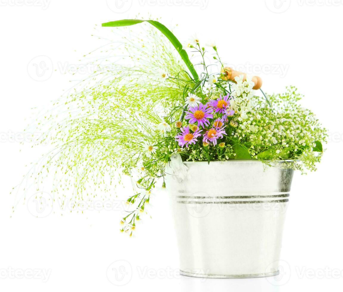 Bucket of fresh spring wild flowers photo