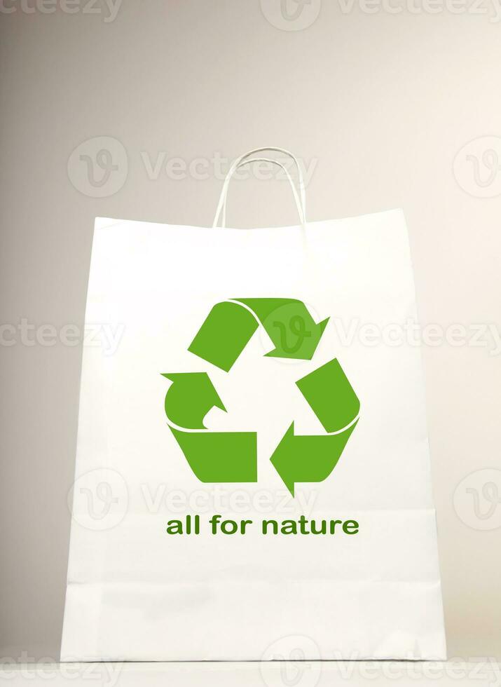 Recycle symbol on the shopping bag photo