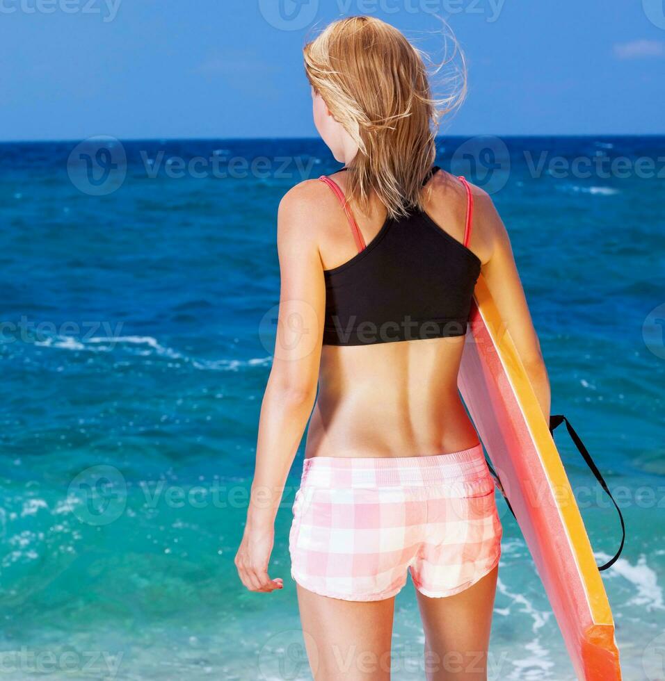 Sportive woman on the beach photo