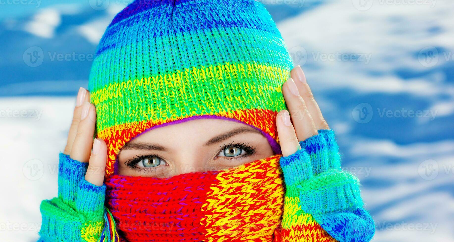 Close up on covered face with blue eyes photo