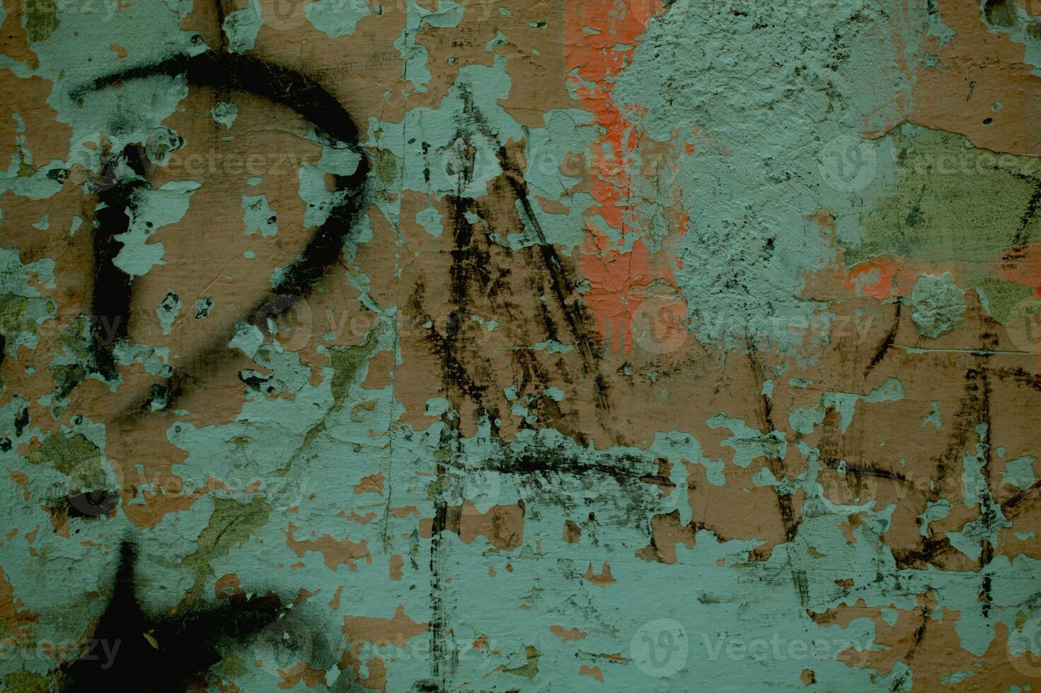 Scribbled graffiti on an old dilapidated wall photo