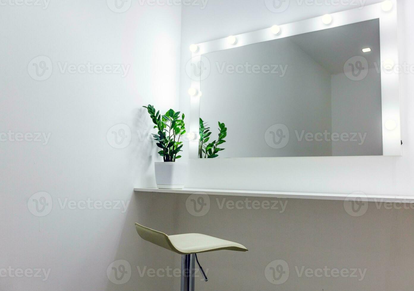 Woman's makeup place with mirror and bulbs photo