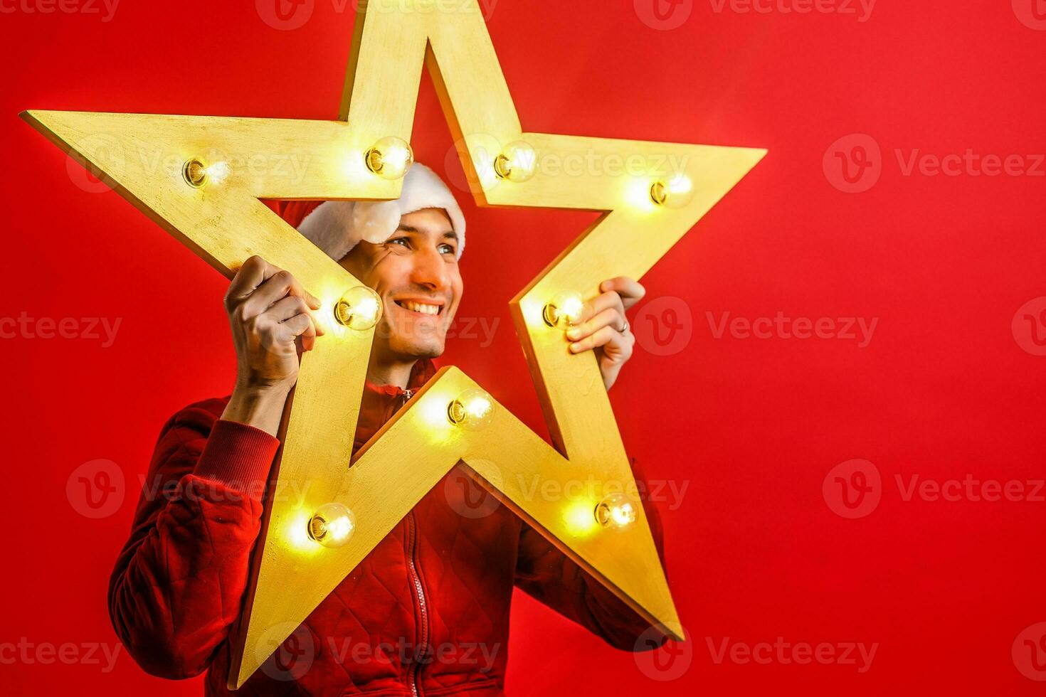 Santa Claus on the red background of the electric star in Christm photo