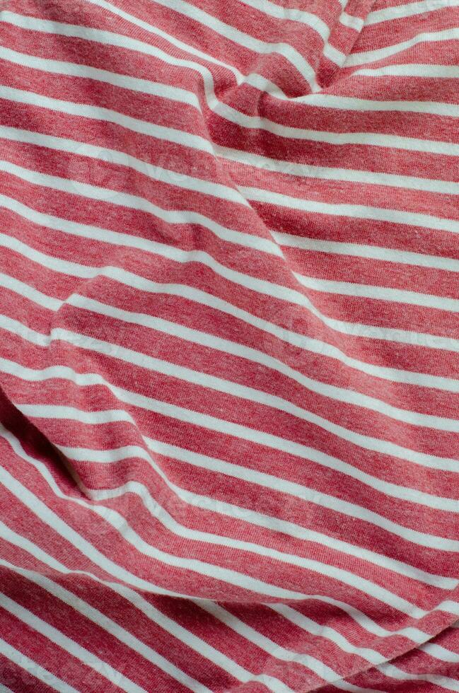 Crumpled Red Color Striped Fabric Texture Background photo