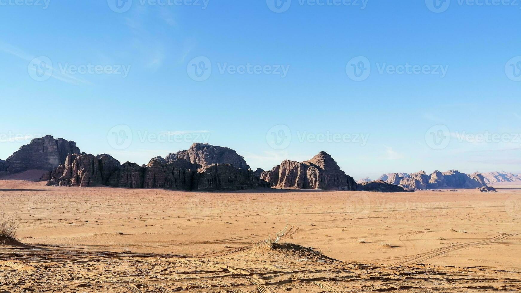 With camel caravan through the deserts of Wadi Rum, Jordan photo