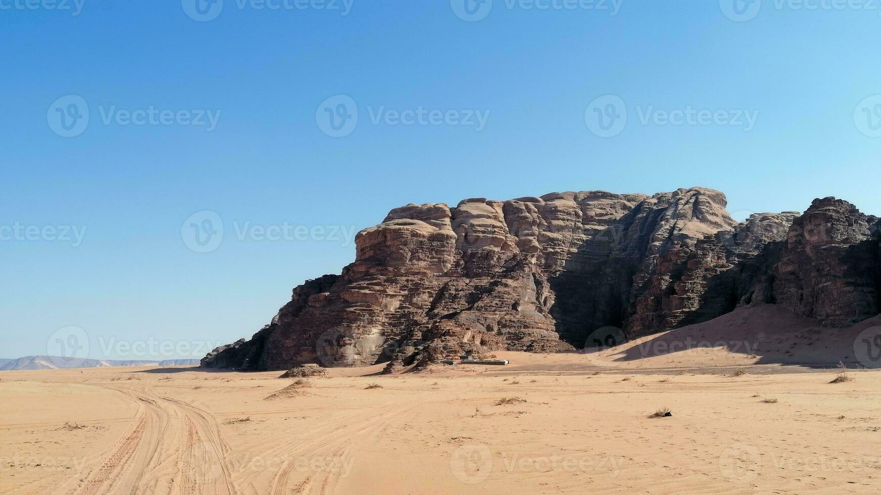 With camel caravan through the deserts of Wadi Rum, Jordan photo