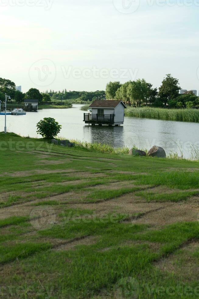 The cottage over the lake in the public park. photo